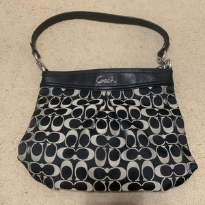 Coach purse with black and tannish gray signature print